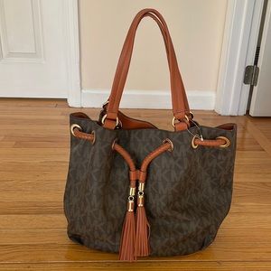 Michaels Kors brown pocket book.